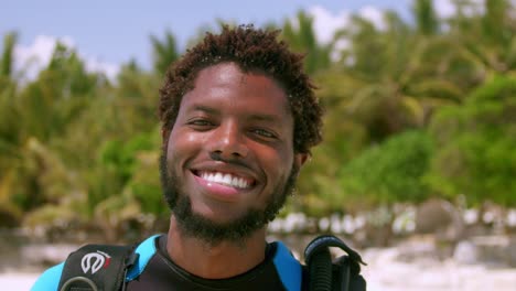 smiling portrait of a coral reef rescue diver at the diani beach in kenya