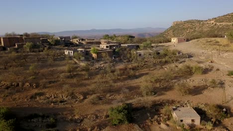 drone view of a small settlement on the top of a mountain