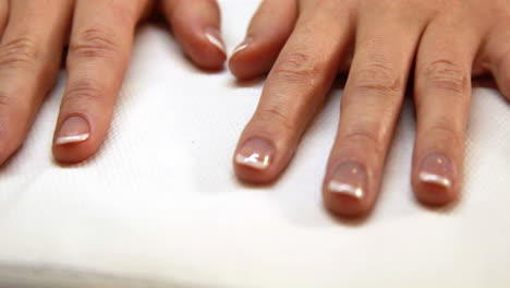 hands showing fresh french manicure