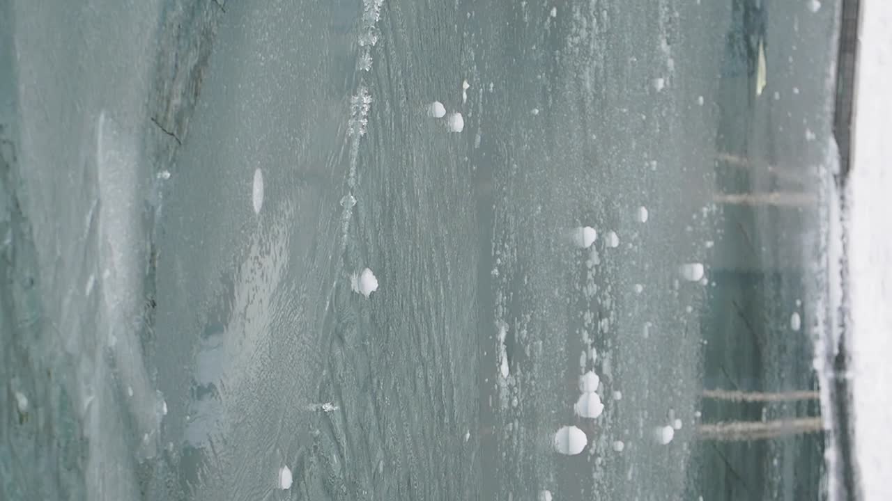 Close-up of Ice and Frost Patterns on a Window