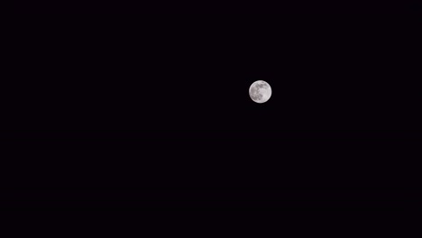 night time lapse of full moon over berlin, berlin, germany