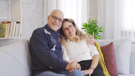 Elderly-couple-in-love-look-at-the-camera.