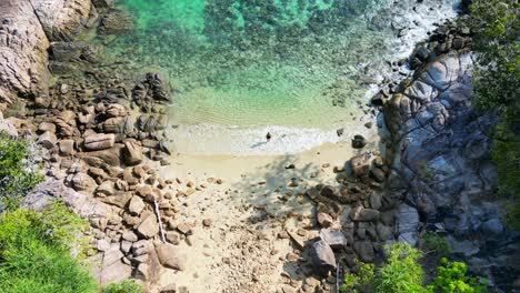 Woman-explores-lonely-dream-beach-on-island