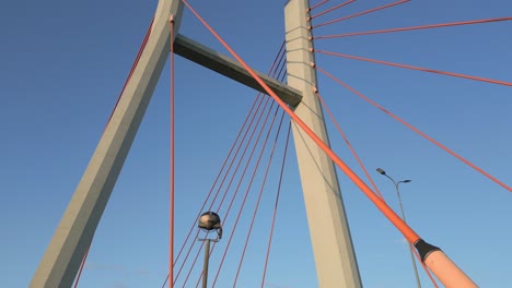 aerial view, camera ascending towards steel cable pylons