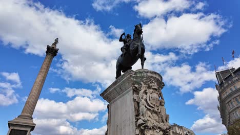 close-up about the nelson's column and equestrian statue of king charles i in trafalgar square, london, england.