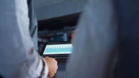 farmer hands using tablet computer at farm closeup. livestock agricultural job.