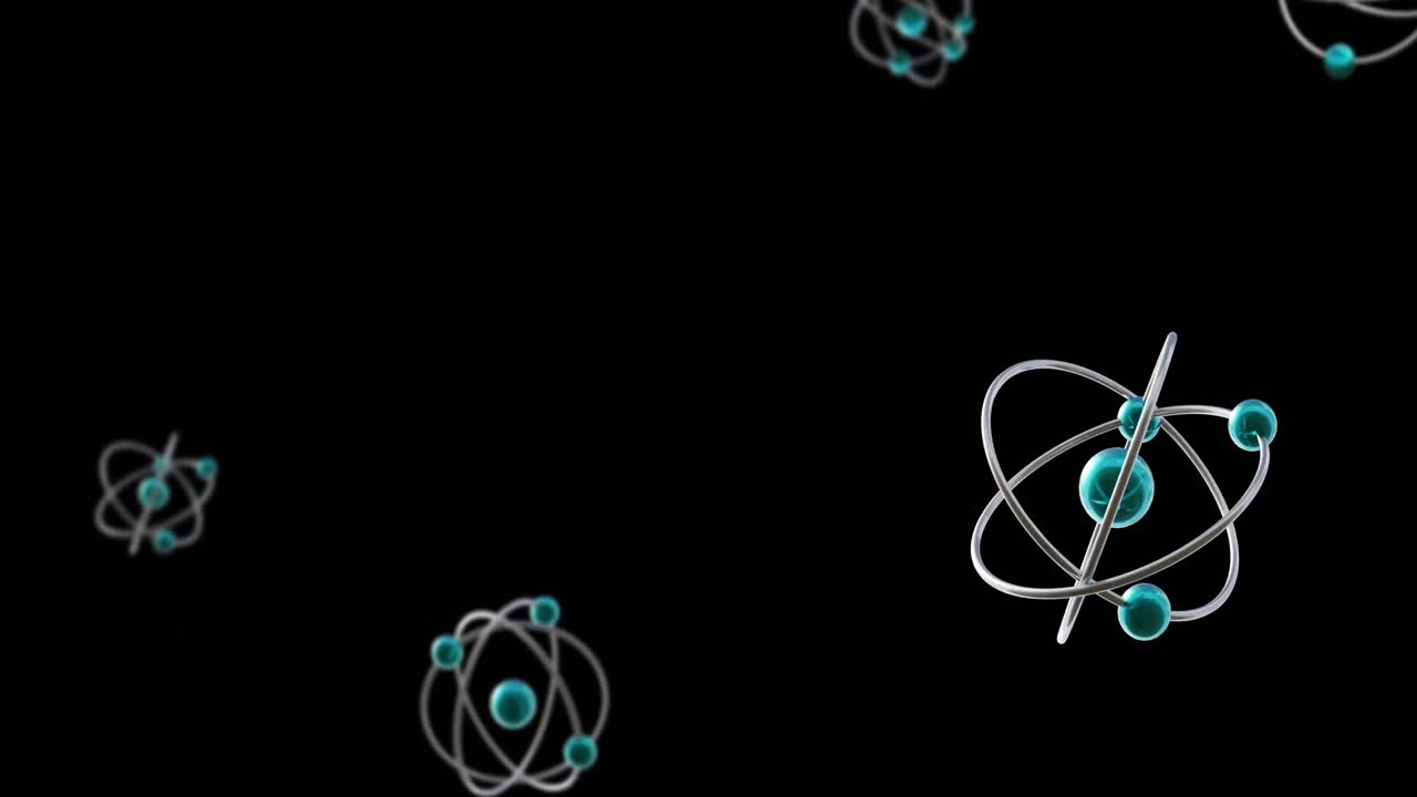 Animation of atom models spinning on black background