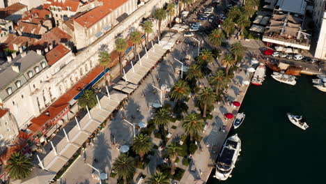 Aerial-View-Of-The-Tourists-Walking-Along-The-Riva-Promenade-In-Split-City,-Croatia