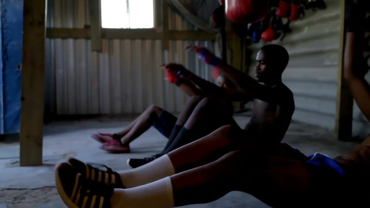 Male boxers exercising in fitness studio 4k