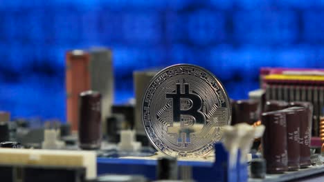 moneda de bitcoin en una placa base de una computadora