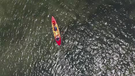 aerial footage of two people in a kayak