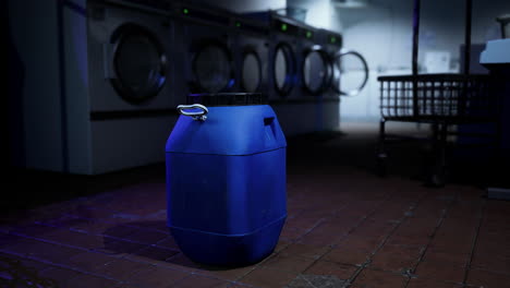 blue container in an empty laundry room