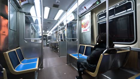 static shot of person riding subway train in downtown chicago