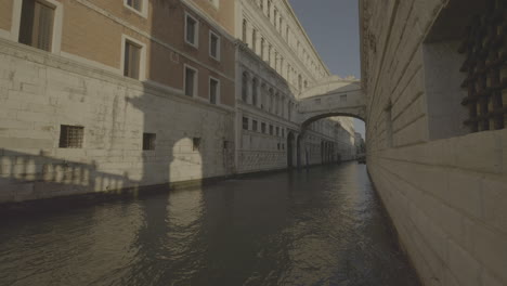 venice canal with bridge and shadows