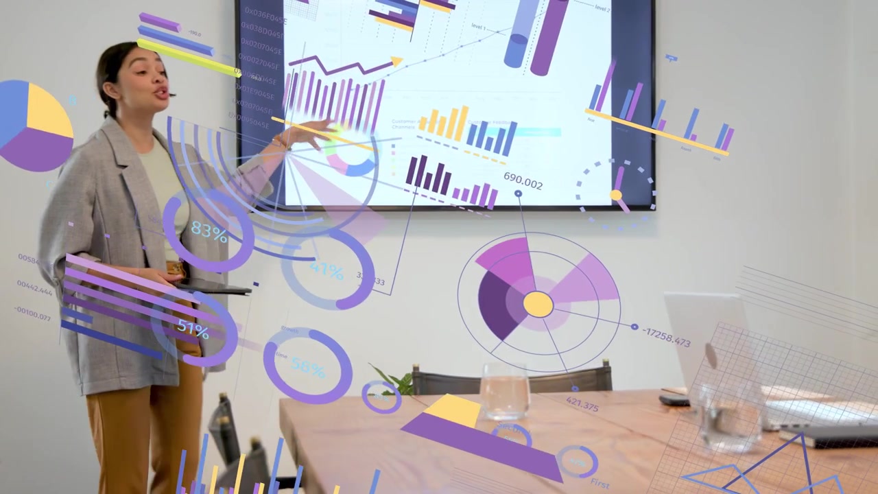 Presenter walking meeting room tapping tablet and causing moving charts explaining business data