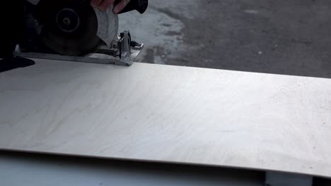 cutting wood with an electric hand saw. woodworking.