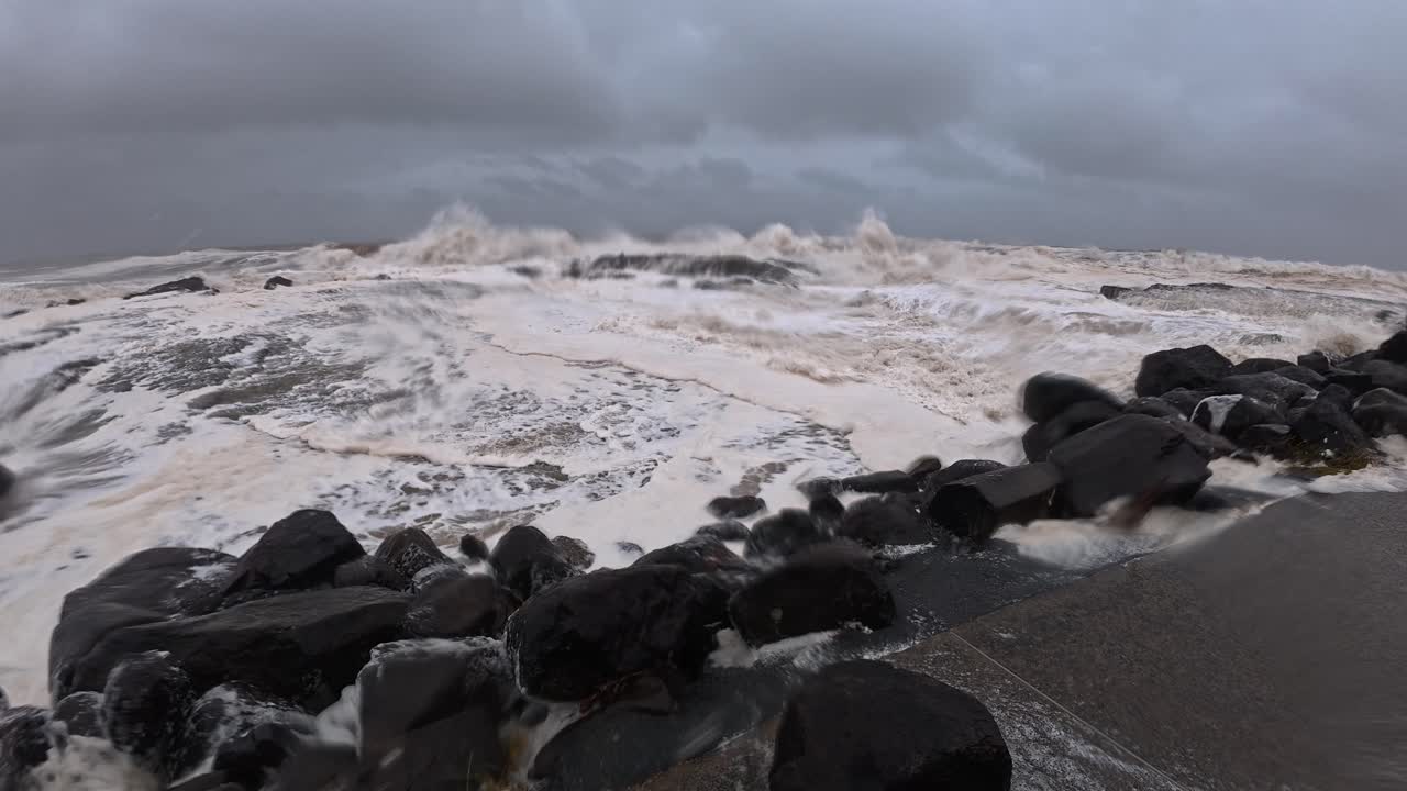Cyclone Alfred - Powerful Waves Crashing Into The Rocks With Sea Foam In Queensland, Australia. - wide shot