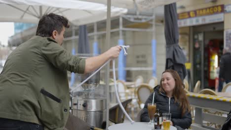 Magician Performing Rope Magic in Outdoor Cafe Setting