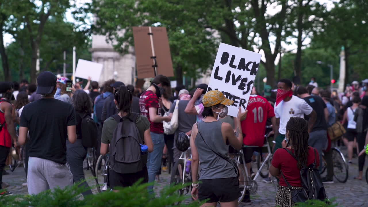 People holding black lives matter signs at Brooklyn protest