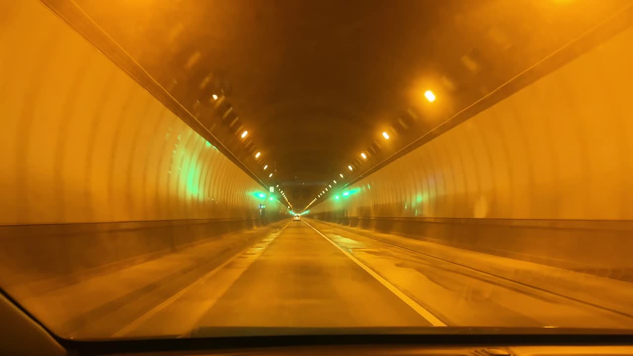 POV shot from a moving vehicle driving through the Devil's Slide tunnel near Half Moon Bay, California. 4K