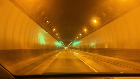 pov shot from a moving vehicle driving through the devil's slide tunnel near half moon bay, california. 4k