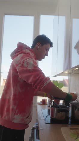 young person cooking in a kitchen