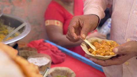 man making the papdi chaat recipe closeup view