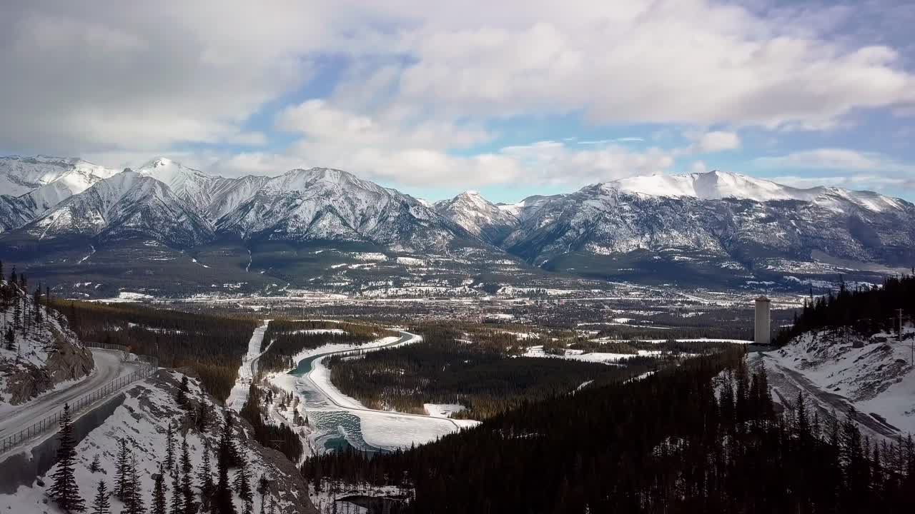 A Canadian road on the mountain, overlooking the beautiful landscape of Spray Lakes Reservoir - aerial
