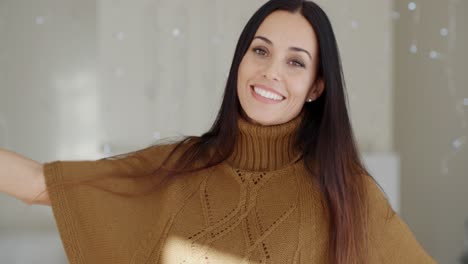 Happy-vivacious-young-woman-indoors-at-home