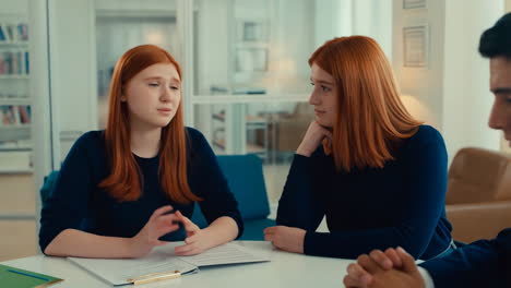 Three People Engaged in a Business Meeting or Discussion