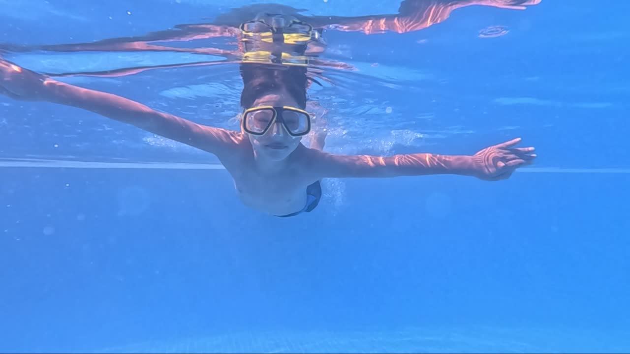 Enjoy a captivating snorkeling adventure as an individual immerses themselves in serene blue waters, discovering the wonders beneath the surface. The tranquility and beauty are mesmerizing