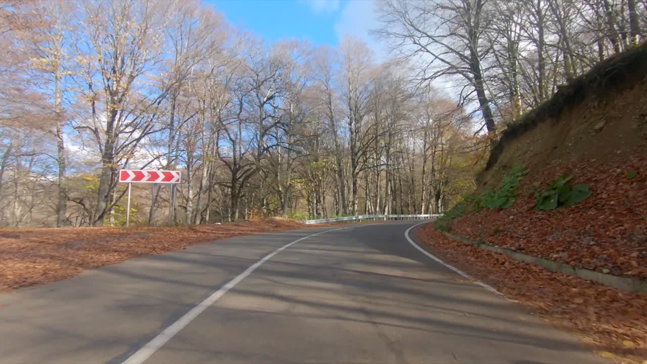 Driving on an empty road in Autumn 2