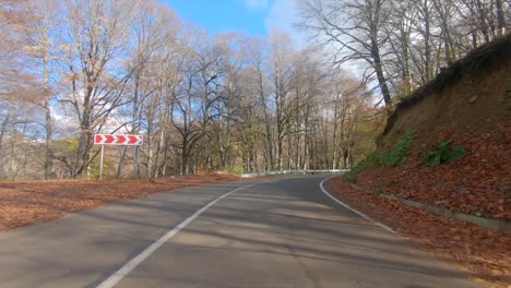 driving on an empty road in autumn 2