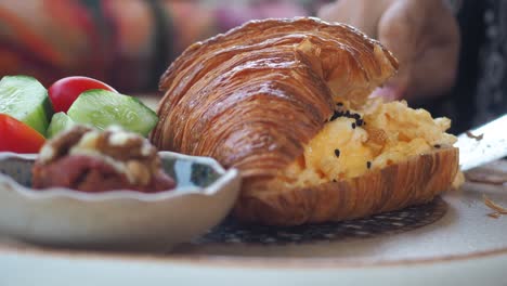 croissant with eggs and vegetables