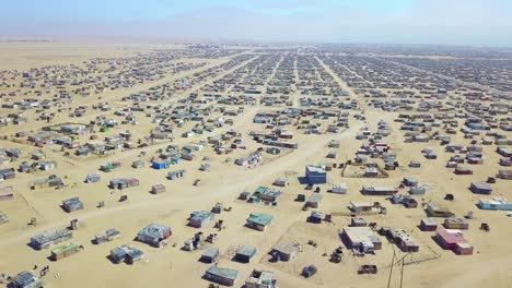 Aerial-over-a-strange-abandoned-town-of-empty-lonely-suburban-tract-houses-in-the-desert-of-Namibia-Africa-2