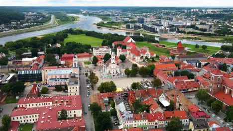 drone shot over kaunas old town with a view of kaunas cathedral basilica, town hall, the church of st