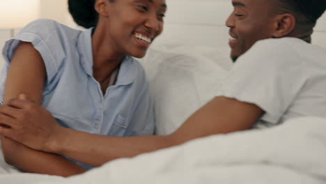 Happy-black-couple-bonding-in-bed