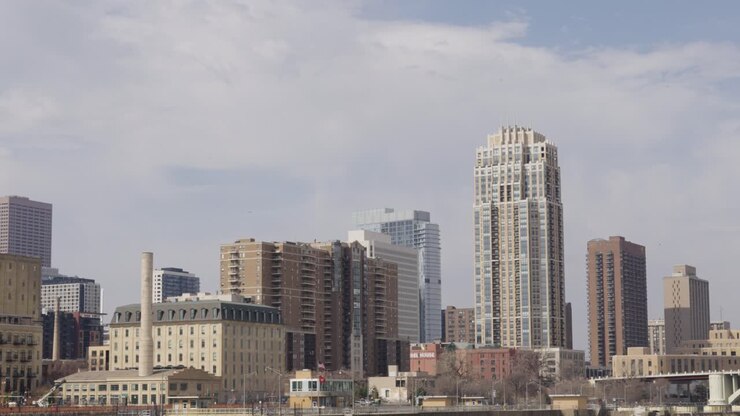 Daytime Sky With Cloudscape Passing Over Minneapolis Skyline In Minnesota, United States. Timelapse