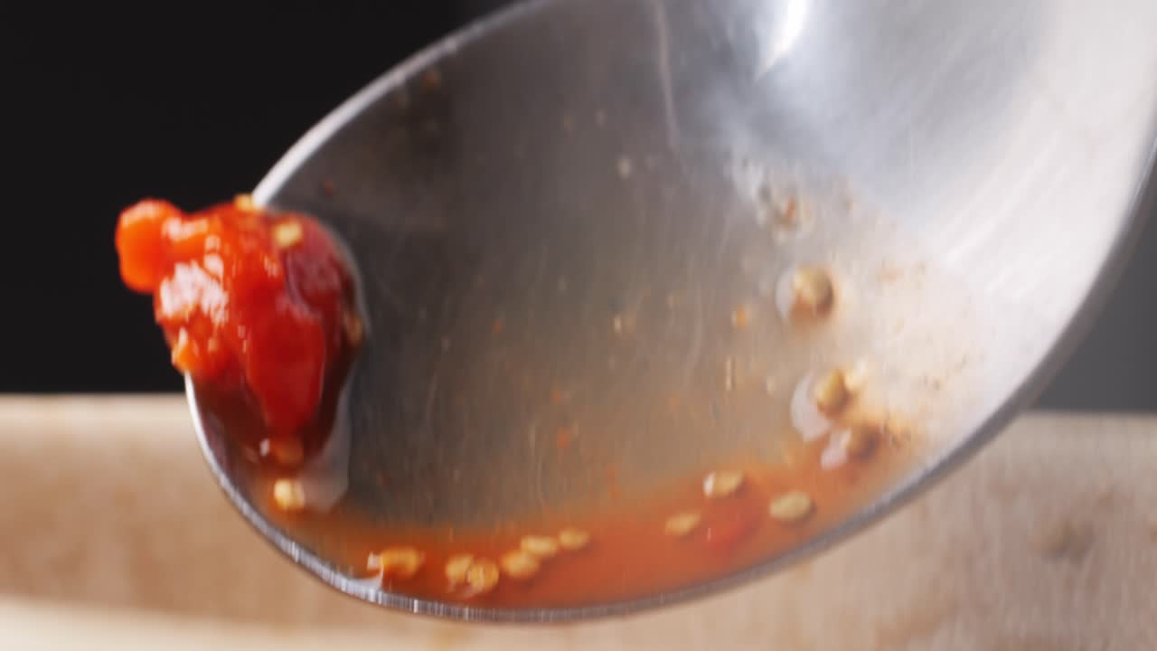 Spicy Red Chili Sauce on Spoon