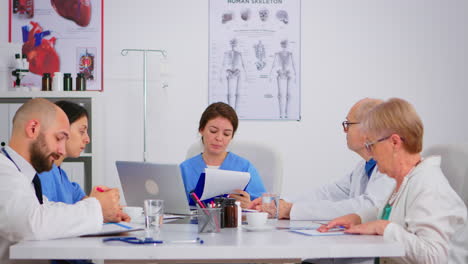 nurse presenting symptoms of disease using clipboard