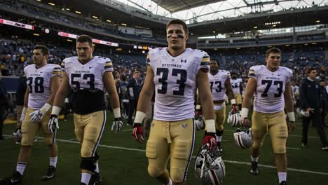 determined athletes leave the field following a hard-fought football game, reflecting resilience and team spirit as they walk towards the tunnel