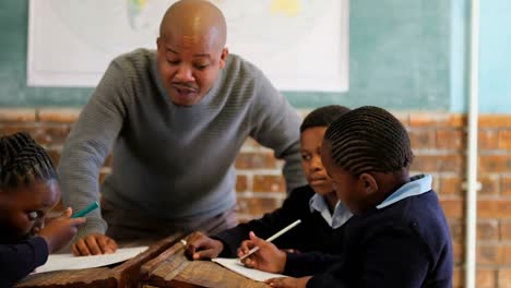 male teacher teaching students in the classroom 4k
