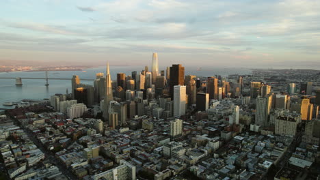 aerial tilt shot rising in front of the sunlit skyline of san francisco, ca, usa