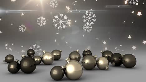 Animation-of-christmas-baubles-over-snow-falling