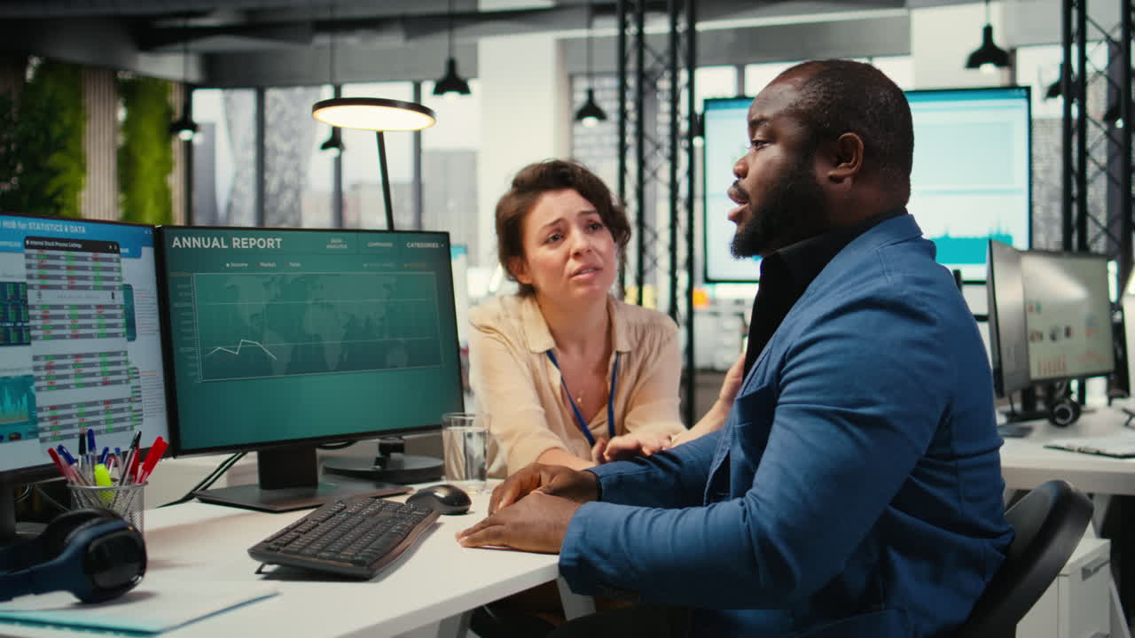 Vertical Video Exasperated black manager dealing with a stressful situation at the office
