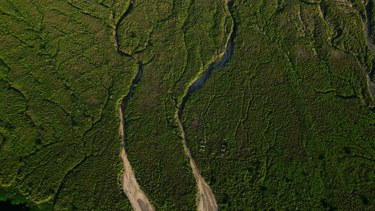 Cinematic aerial view of clouds casting shadows across Taal Volcano, adding depth, contrast, and mood to this iconic Philippine landscape