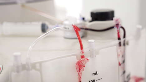 centrifuge equipment with blood samples in the tubes. plasma extraction. prp therapy preparation.