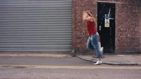 Contemporary-funky-caucasian-woman-street-dancer-dancing-freestyle-in-the-city