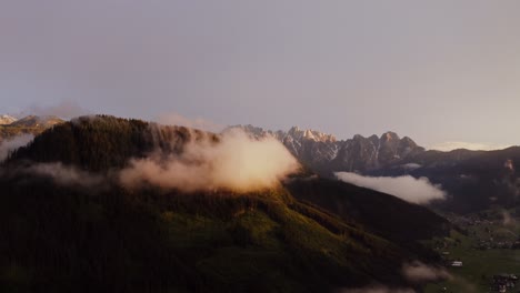 sunrise or sunset over misty mountains