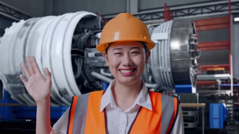 engineer waving at factory
